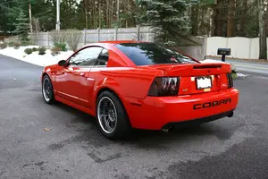 orange-mustang-cobra.webp