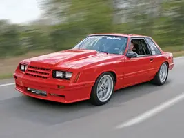 mmfp_0811_03_z+1988_ford_mustang_coupri+left_front_view_driving.webp