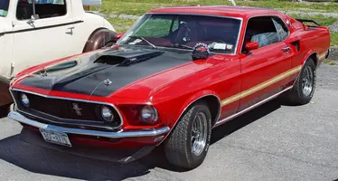 1969-Ford-Mustang-Mach-1-Front-Angle-Maroon-sy.webp