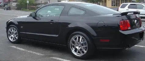 car with chrome cobra wheels2.webp