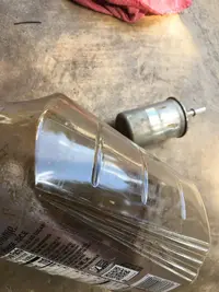 nasty fluid from old fuel filter.webp