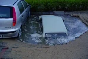car-in-huge-puddle.webp