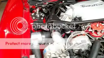 TrickVert's image of cfm one way breather with silicone hose putting breather over the discha...webp