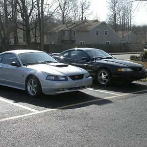 Outside a ghetto apartment alongside my former 2002 GT