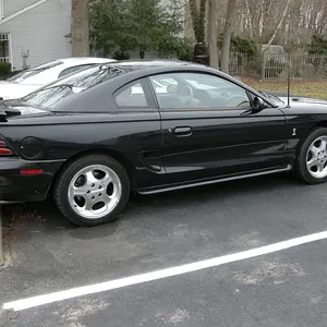 Outside a ghetto apartment alongside my former 2002 GT