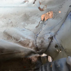Damage viewed from inside the engine bay